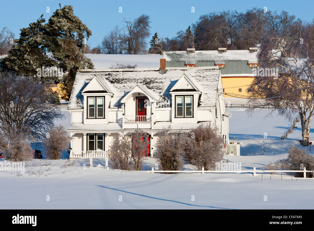 White house in the winter snow, Prince Edward Island, Canada. Stock Photo
