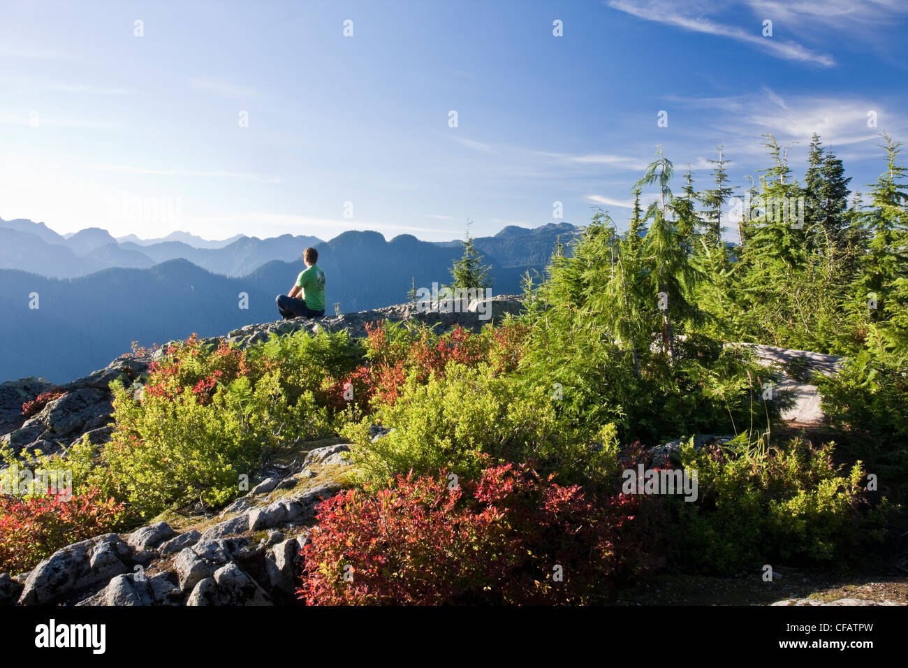 Hiker sitting on top of Dog Mountain at Mount Seymour Provincial Park