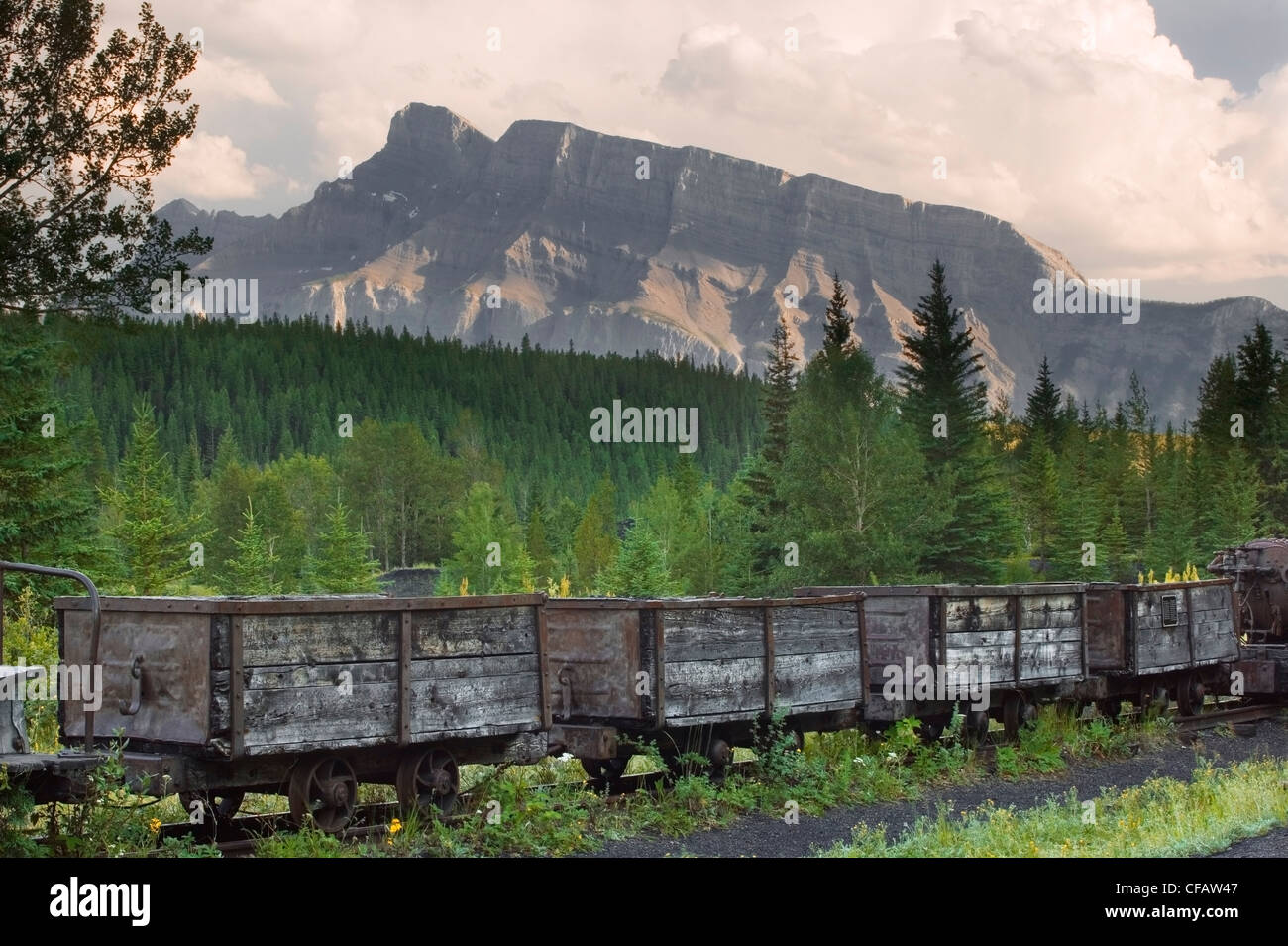 Coal cars at Lower Bankhead with Mt. Rundle in the background, Banff National Park, Alberta, Canada Stock Photo