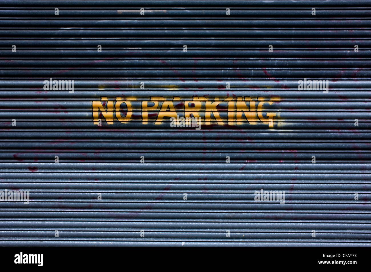 NO PARKING sign on garage fence, London. Stock Photo