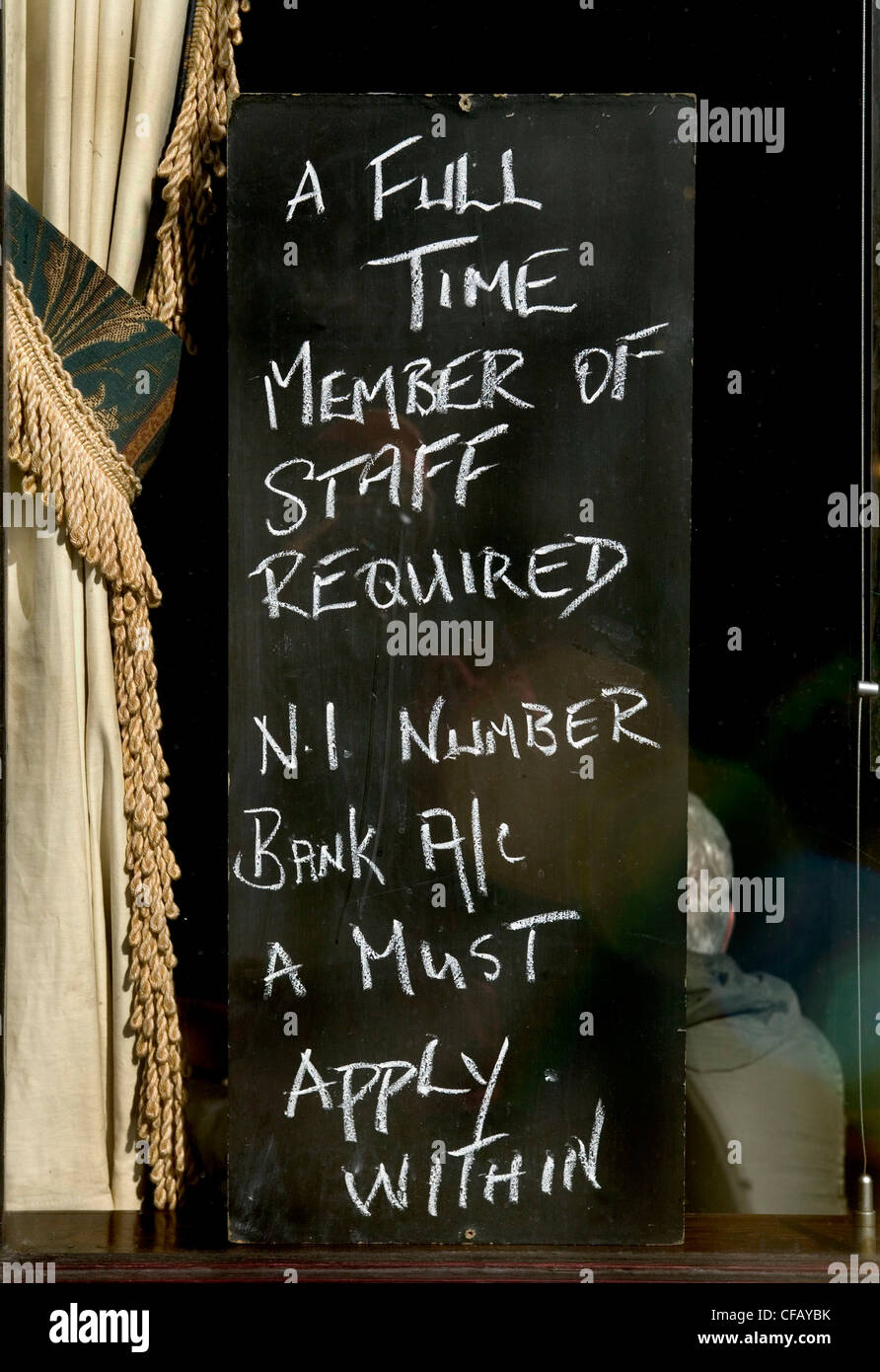 A sign in a London pub window advertising for a full time member of staff. Stock Photo
