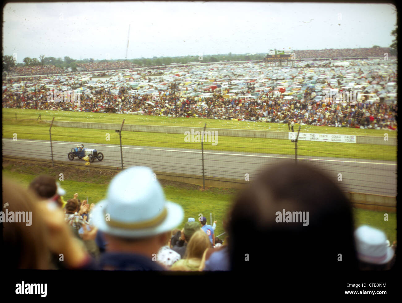 crowd people turn 1973 Indianapolis 500 track infield crowded audience stands Stock Photo