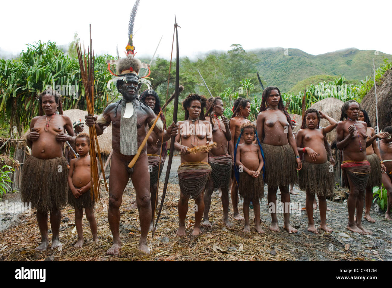 Dani tribespeople participating in traditional dance in their village, New Guinea, Indonesia. Stock Photo
