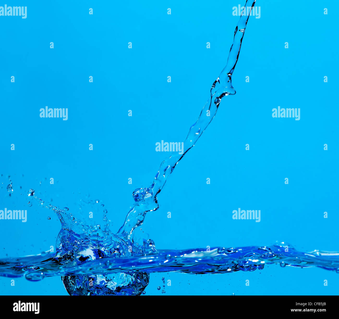 Splashes and water waves. Blue background Stock Photo - Alamy