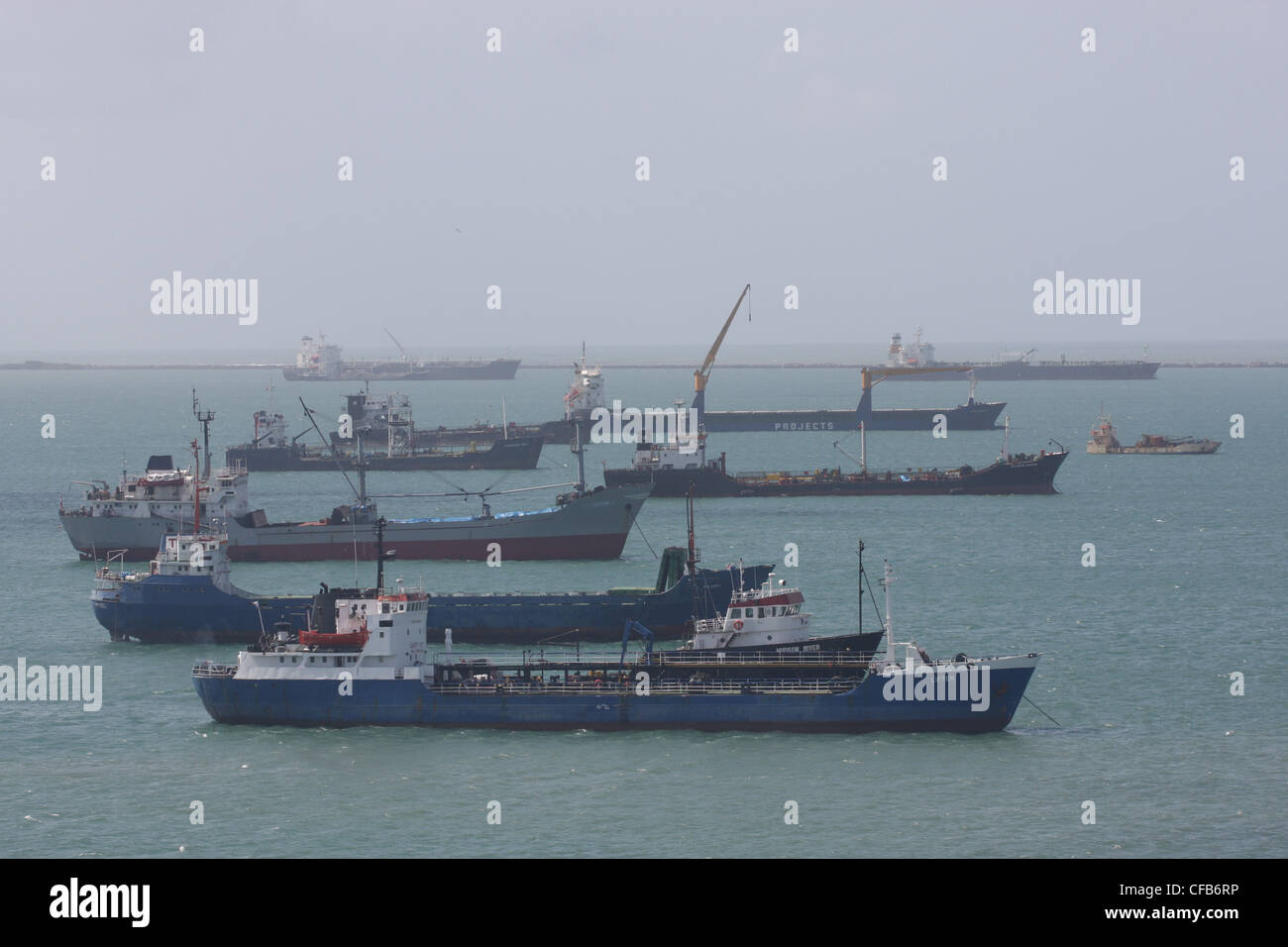 Ships at anchor inside the breakwaters at Colon, Panama Stock Photo