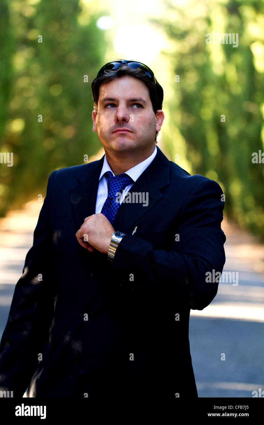 View of a young male business man on a asphalt road. Stock Photo