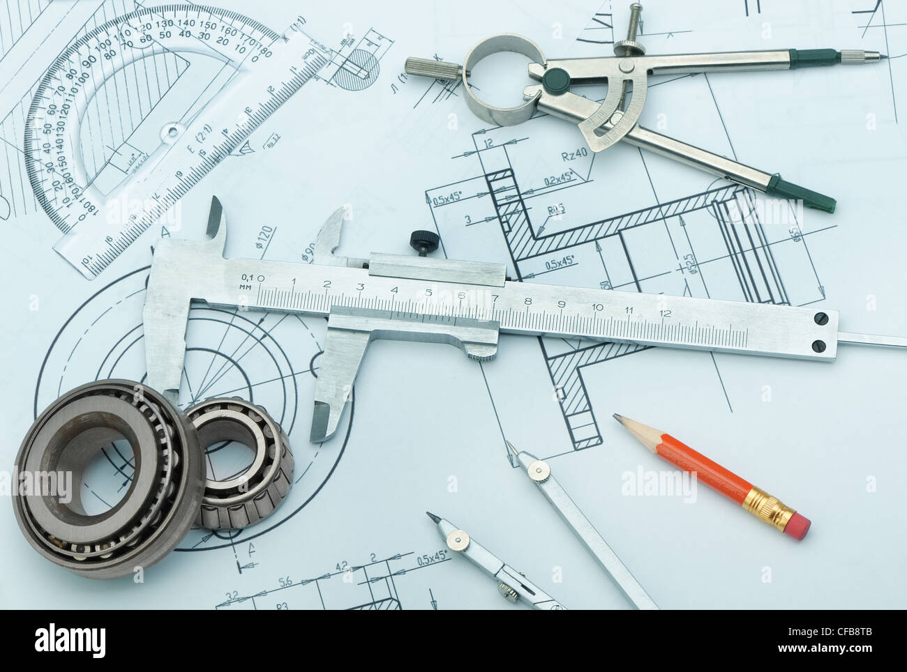 The plan industrial details, a protractor, caliper, divider and bearing. A photo closeup. Blue