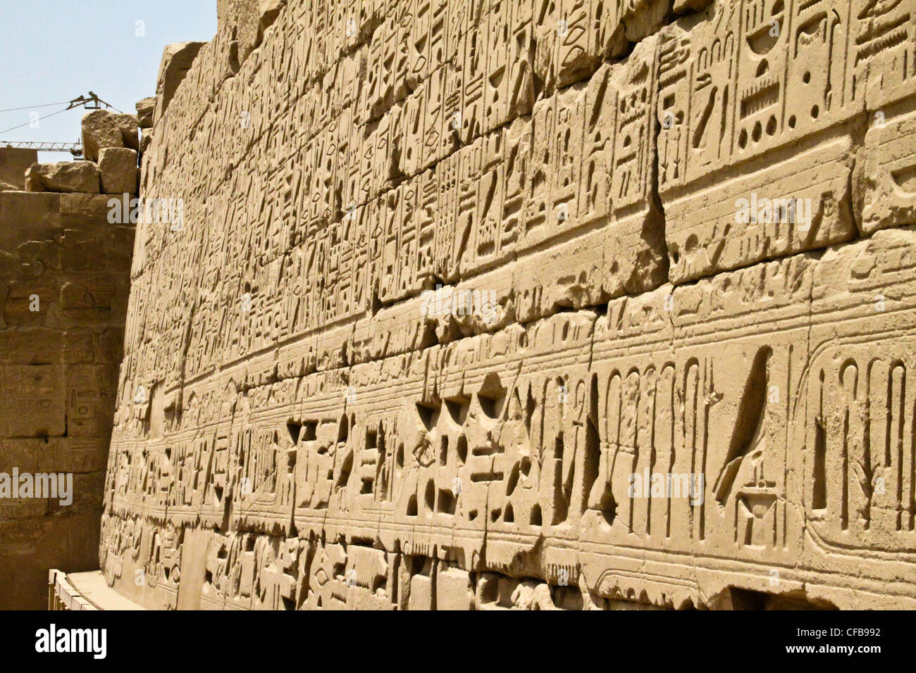 Hieroglyphics in bas-relief of the great temple of Karnak dedicated to the worship of Amun, in the city of Luxor in Egypt Stock Photo