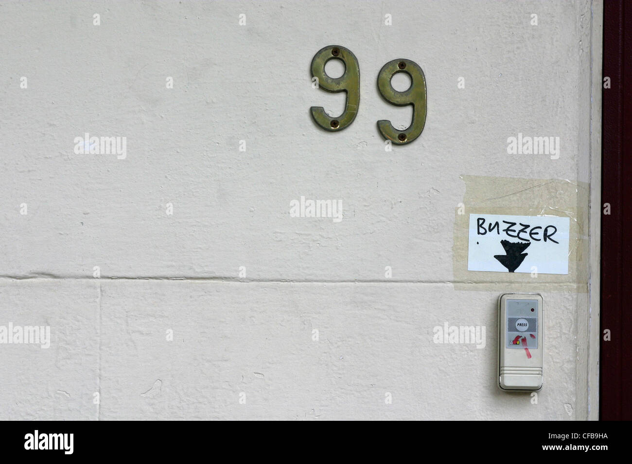 The number 99 on a flat door, Sydney, Australia. Stock Photo