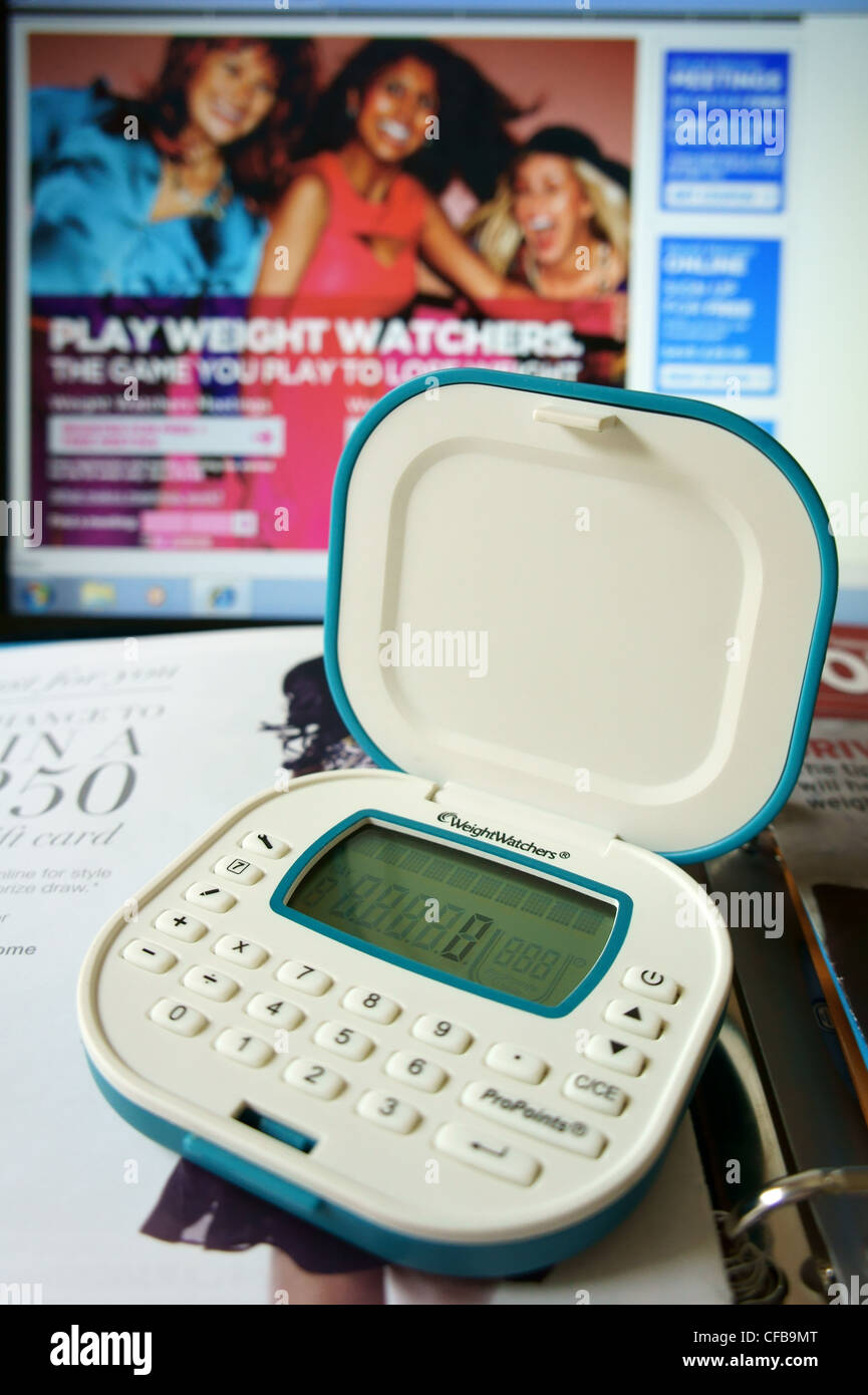 Weight Watchers Pro Points calculator resting on weightwatchers magazines  with weightwatchers website in the background Stock Photo - Alamy