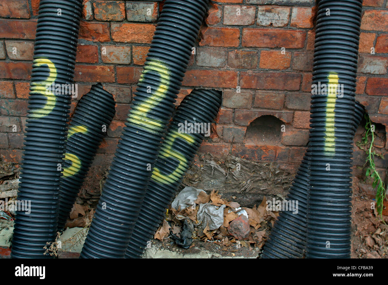 Yellow numbered underground electrical pipes Stock Photo Alamy