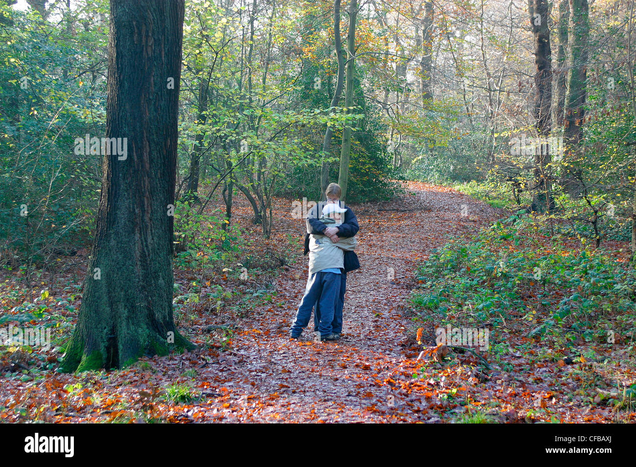 Queen's wood, north London. Mother and son walking in the autumn, London, UK Stock Photo