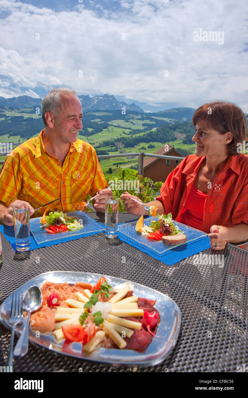 Appenzell, Appenzell Innerroden, Alpstein, Switzerland, Europe, food, eating, couple, seniors, cheese, sausage, Stock Photo