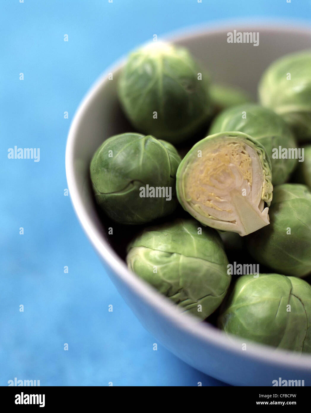 Detail of bowl of brussel sprouts, one cut in half Stock Photo Alamy