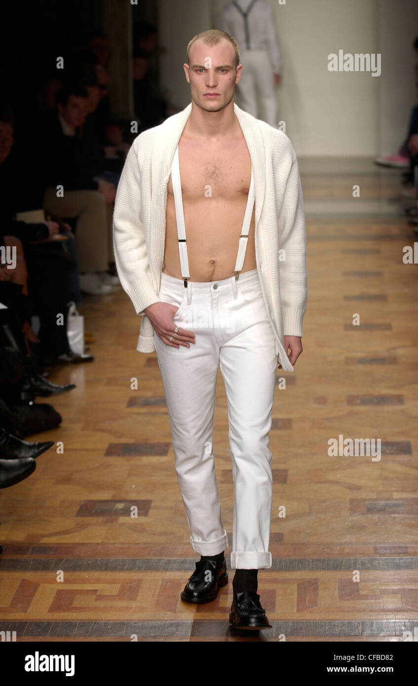 Jasper Conran Milan Menswear Ready to Wear Autumn Winter Model very short  brown hair and silver rings, wearing white cardigan Stock Photo - Alamy