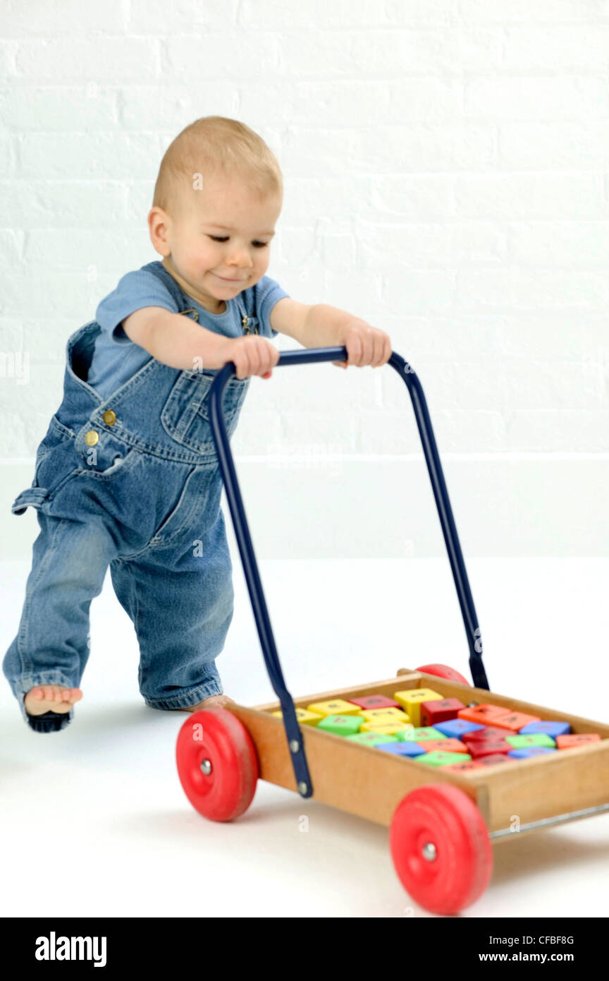 Male baby wearing blue t shirt and blue 