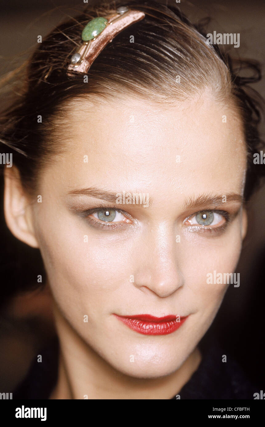 Backstage Milan Spring Summer Prada Model Carmen Kass long stright blonde  hair brown roots, pale pinkmatt lipstick, looking to Stock Photo - Alamy