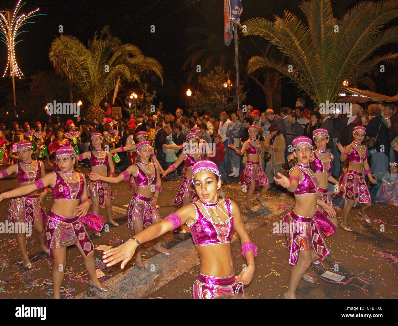 Europe, Portugal, Madeira, Funchal, carnival, dance group, costumes, palms, lights, children, people, persons, street, public fe Stock Photo
