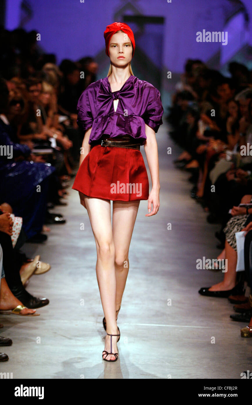 Prada Milan Ready to Wear Spring Summer Female wearing strappy t bar shoes  and red turban, and silk duchesse satin purple Stock Photo - Alamy
