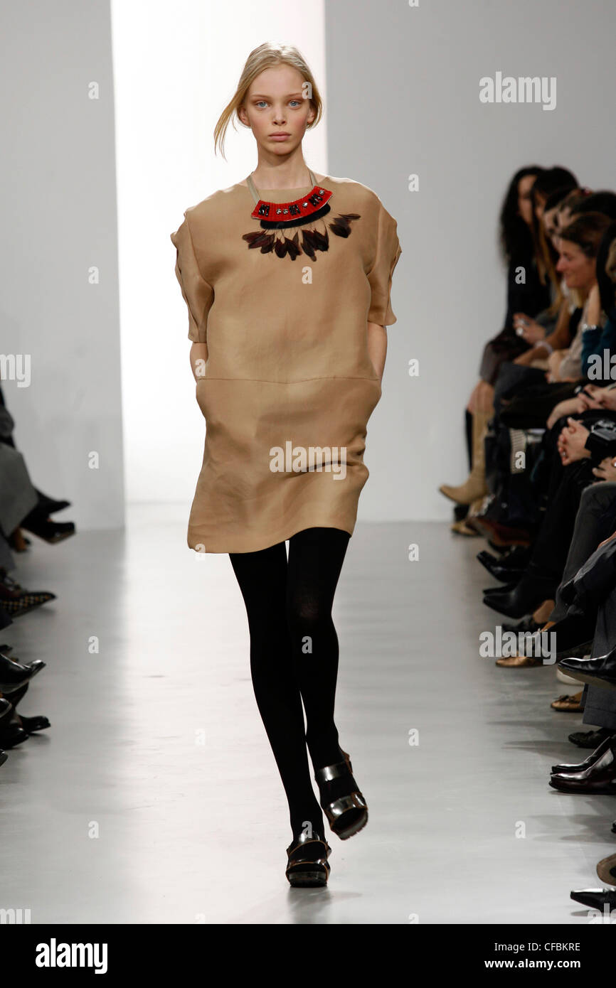 Marni Milan Ready to Wear Autumn Winter Short brown sack dress and black tights Stock Photo