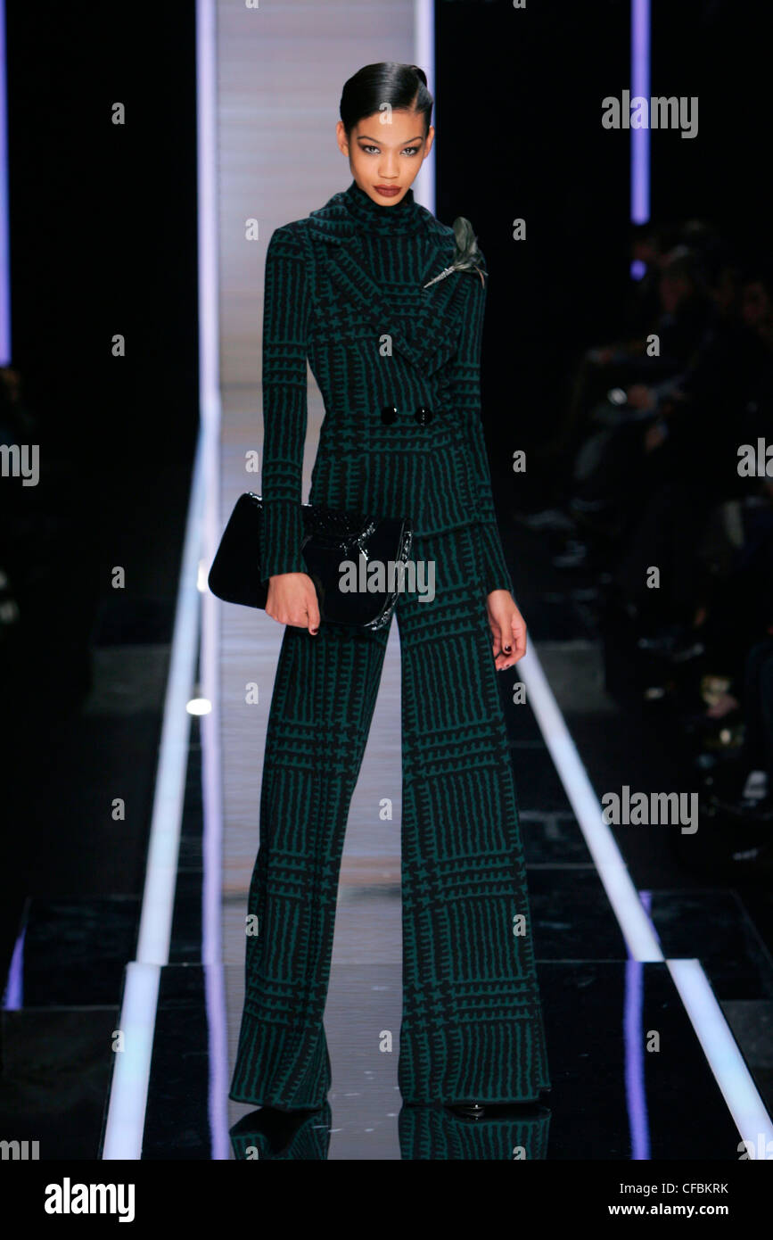 Salvatore Ferragamo Milan Ready to Wear Autumn Winter American model Chanel wearing three piece green patterned palazzo trouser Stock Photo