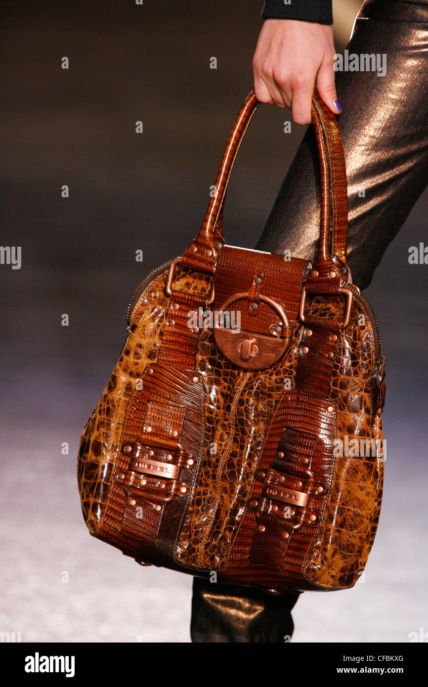 Diesel New York Accessories Autumn Winter Close up of model holding brown  and tan leather bag Stock Photo - Alamy