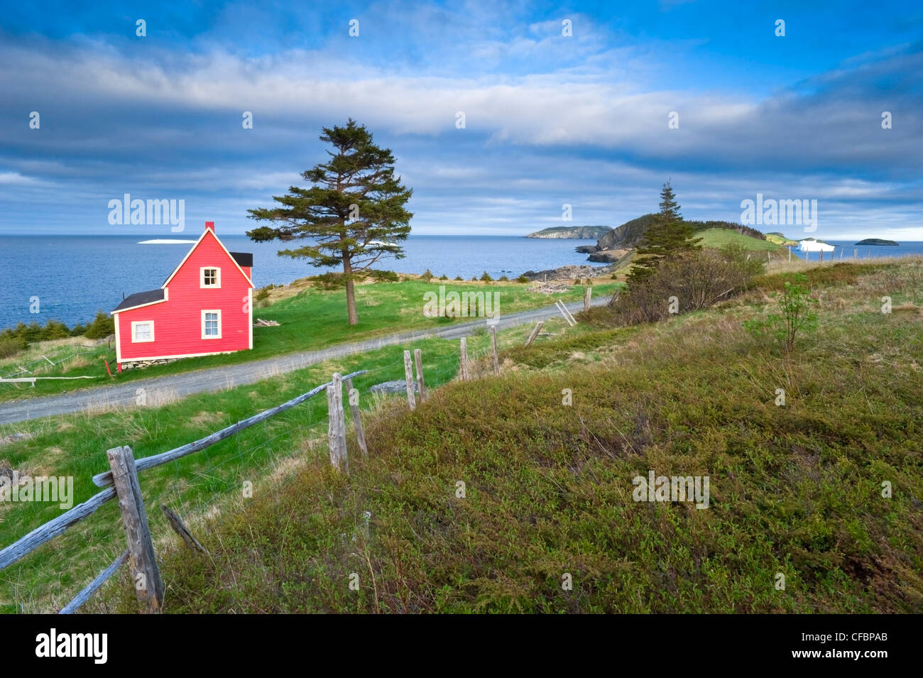 Coastal home and iceberg, Newfoundland, Canada Stock Photo Alamy