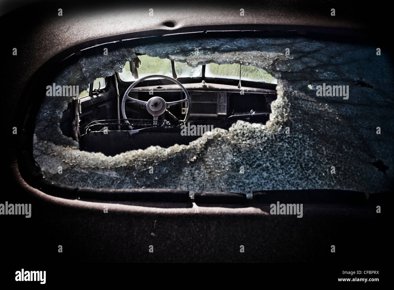 View though old Chevy's smashed rear window, Saskatchewan, Canada Stock Photo