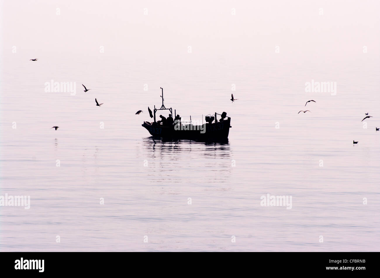 Fishermen boat silhouette hi-res stock photography and images - Alamy