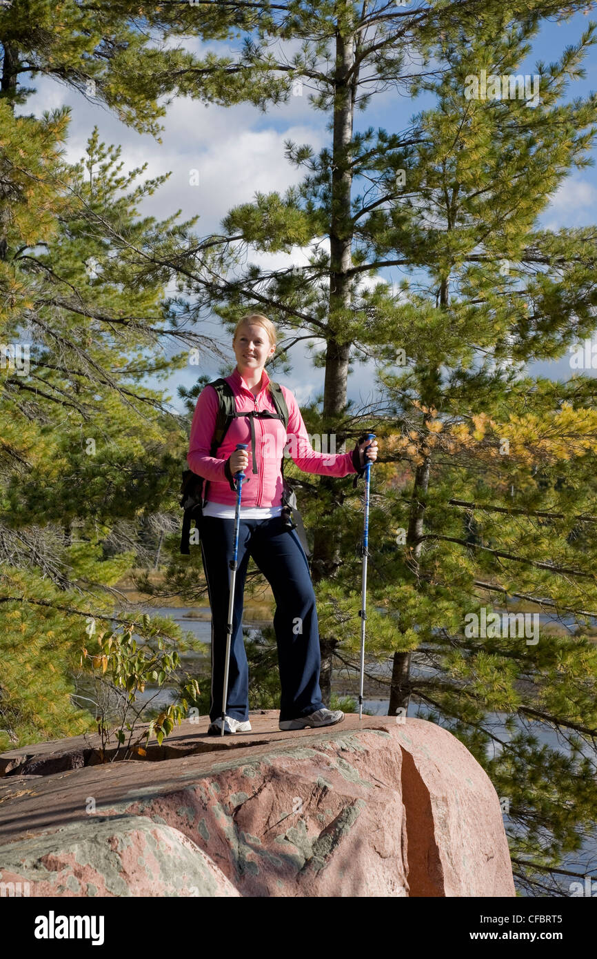 Female hiker on the Cranberry Bog trail in Killarney Provincial Park