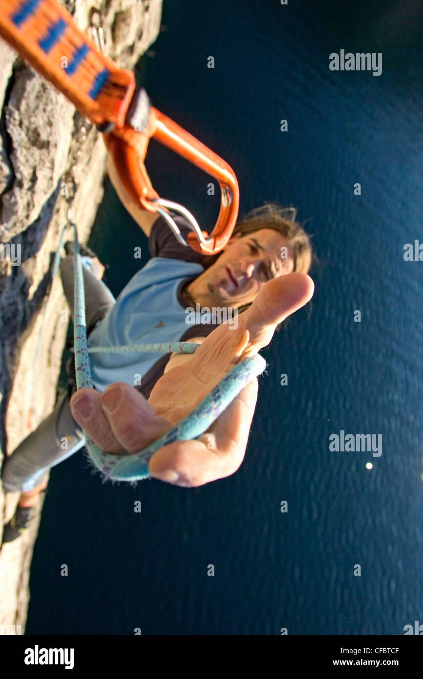 Climber, rope, carbine, snap hook, perspective, climbing, boulder, extreme climbing, risk, lake Garda, sport, protection, backup Stock Photo