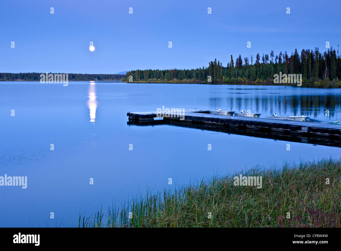 Full moon over wharf at Anahim Lake British Columbia Canada Stock Photo