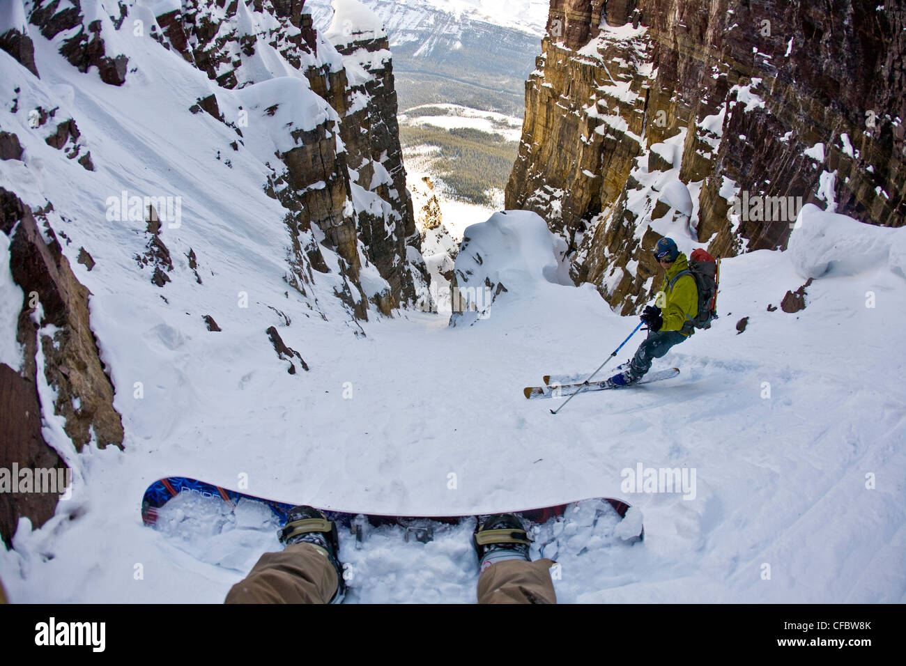 splitboarder backcountry skier begin descent down Stock Photo