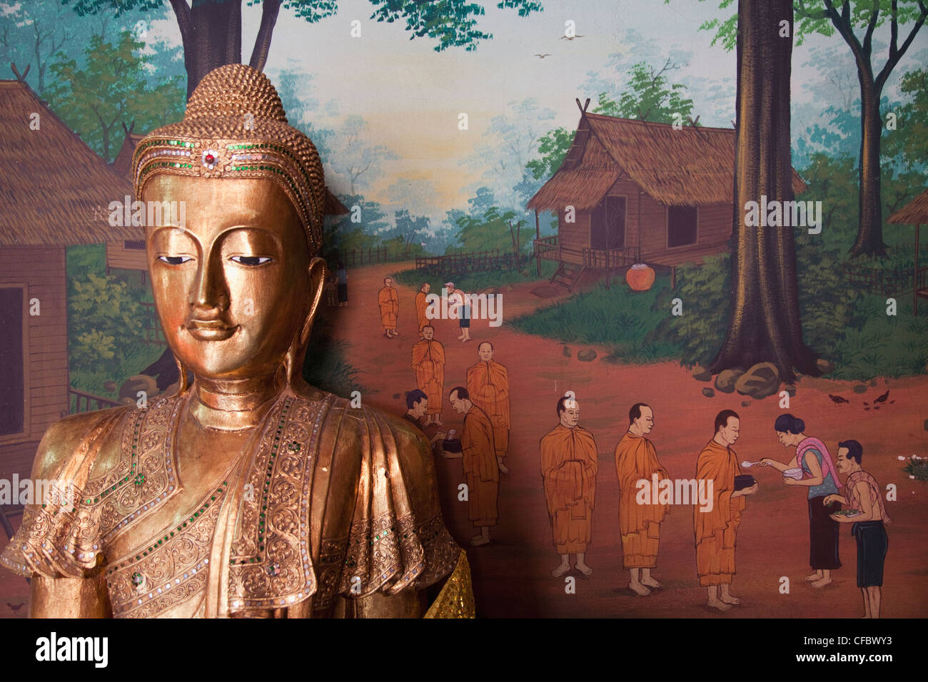 Thailand, Bangkok, Khaosan Road, Wat Chana Songkhram, Buddha Statue and Wall Art depicting Life of The Buddha Stock Photo