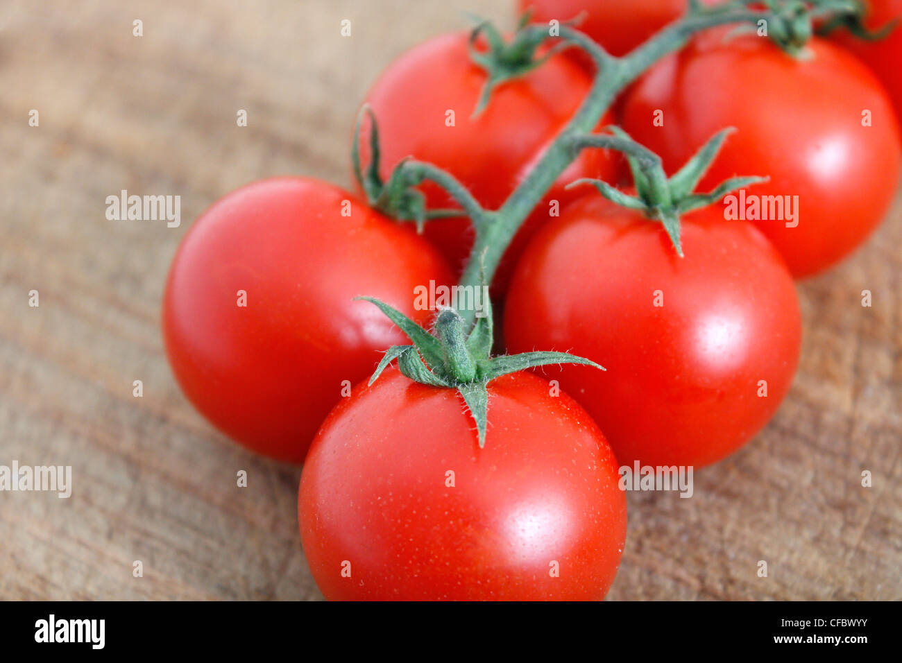 Delicious tomatoes on a chopping board Stock Photo - Alamy