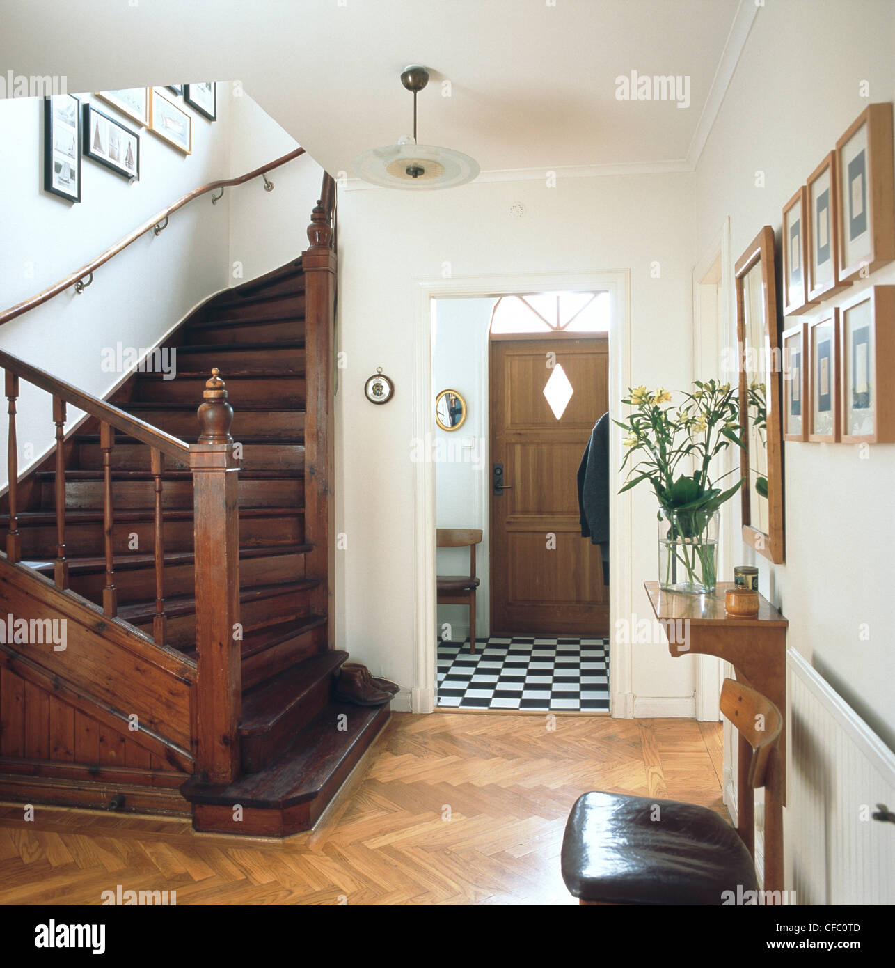 Hallway Curved Wooden Staircase Parquet Flooring And Black And