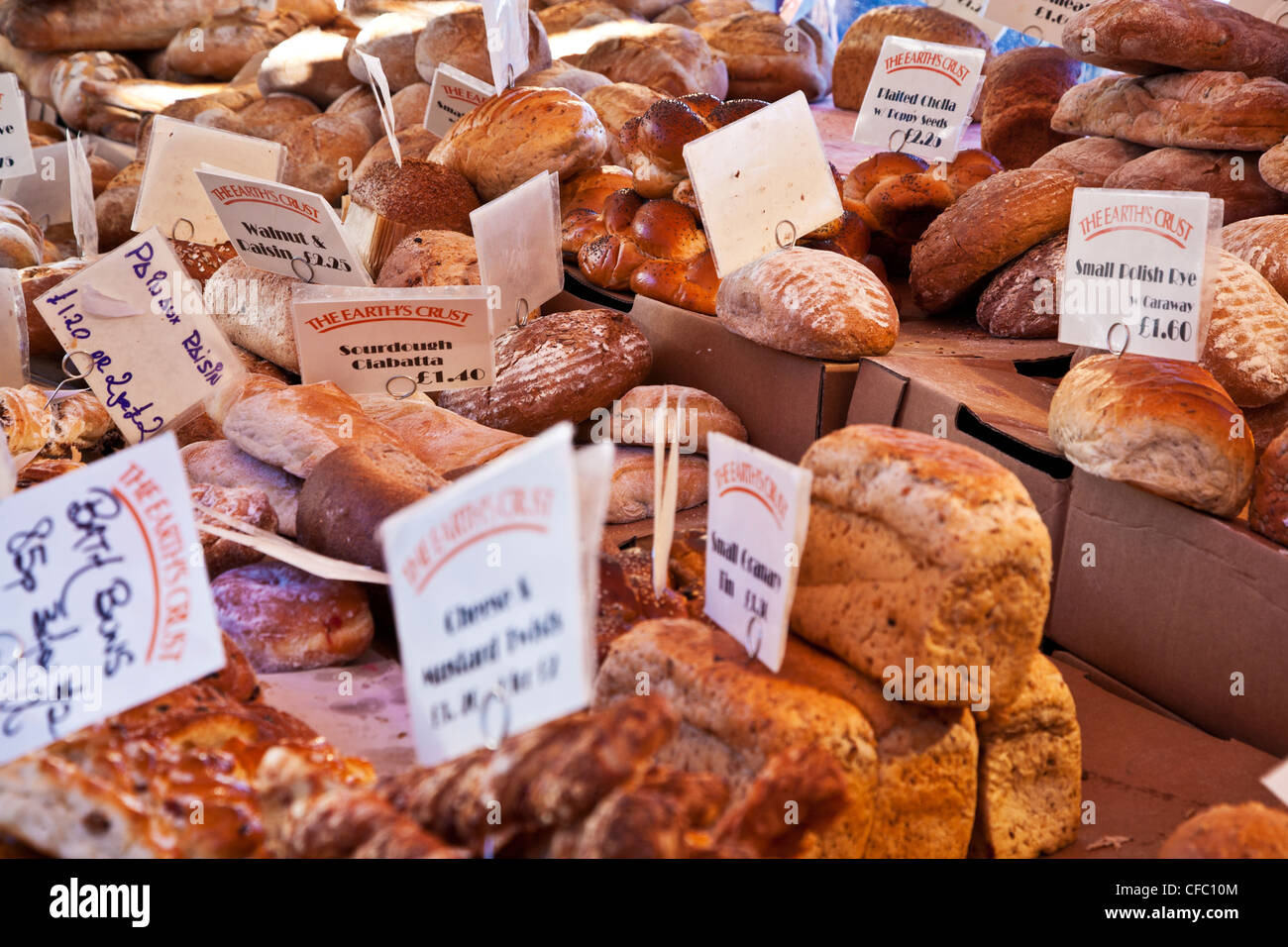 Speciality breads on a bakery stall in the Market Square, Cambridge, England, UK Stock Photo