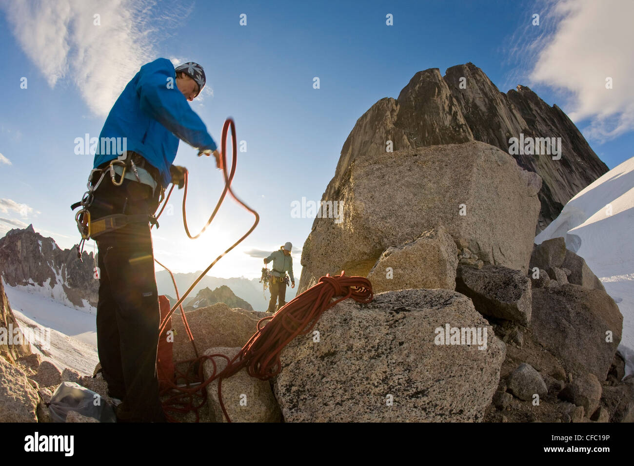Two female climbers prepare for glacier travel in Bugaboo Provincial Park, BC. Stock Photo