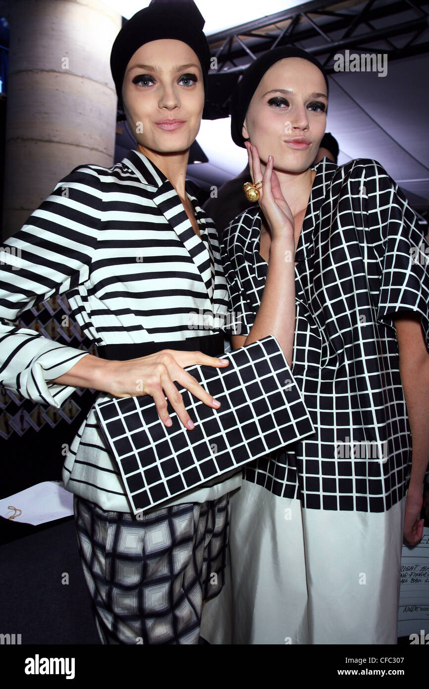 Dries Van Noten Backstage Paris Ready to Wear Spring Summer Models wearing a monochrome striped jacket, black and white square Stock Photo