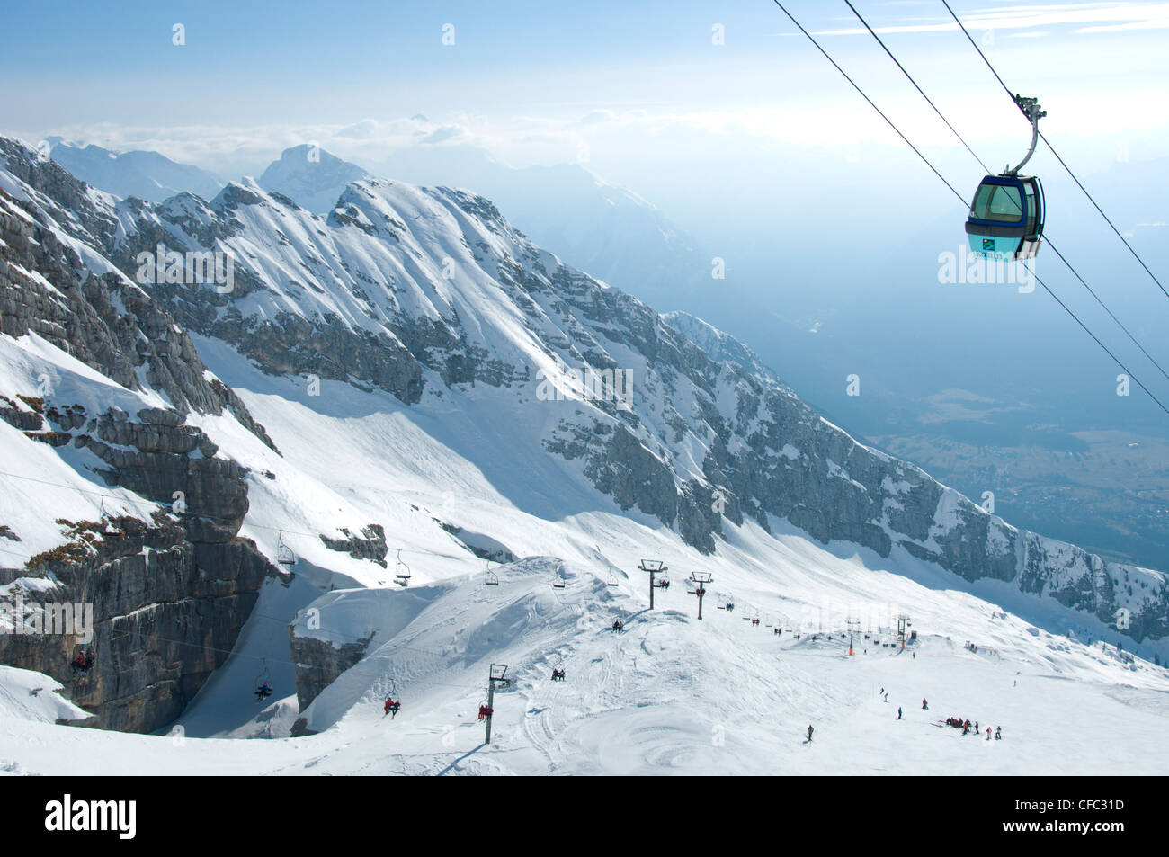 Kanin Ski Area near Bovec, Slovenia shows a gondola and distant peaks of  the Julian Alps Stock Photo - Alamy