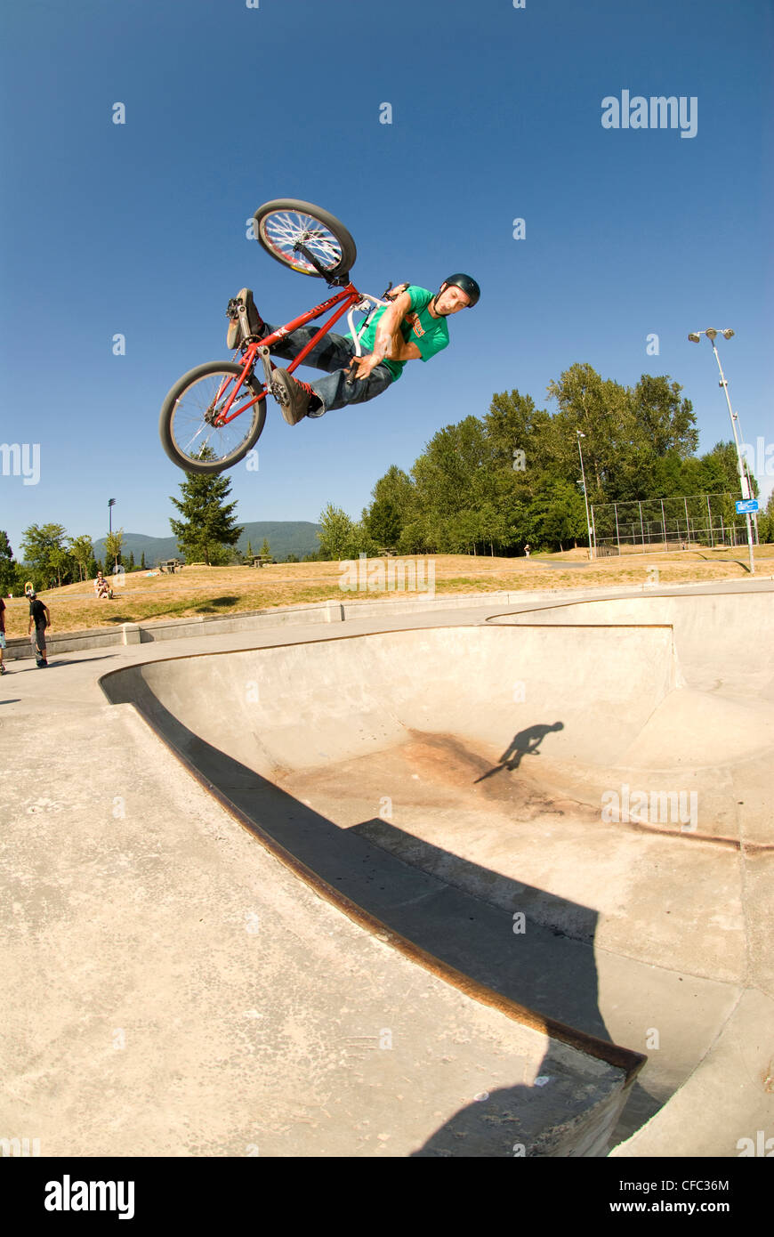 BMXer with an X-up air at Lafarge Skatepark, Coquitlam, BC Canada. Stock Photo