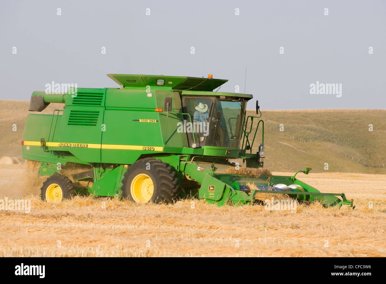 Combining Grain farmer might use own combine Stock Photo