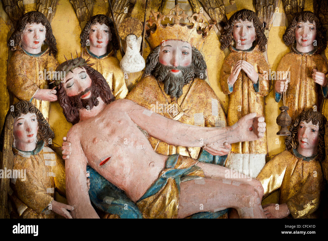 Jesus in the knee of God, surrounded by angels Wood carving in Lye church on Gotland,Sweden Stock Photo