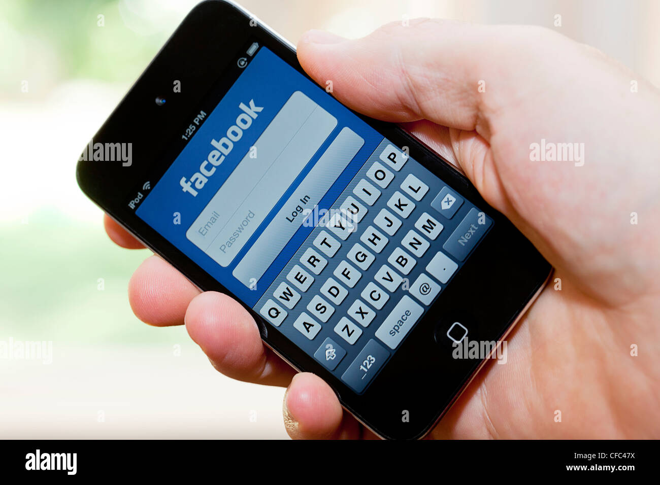 Log In To Facebook On An Apple Ipod Touch Stock Photo Alamy