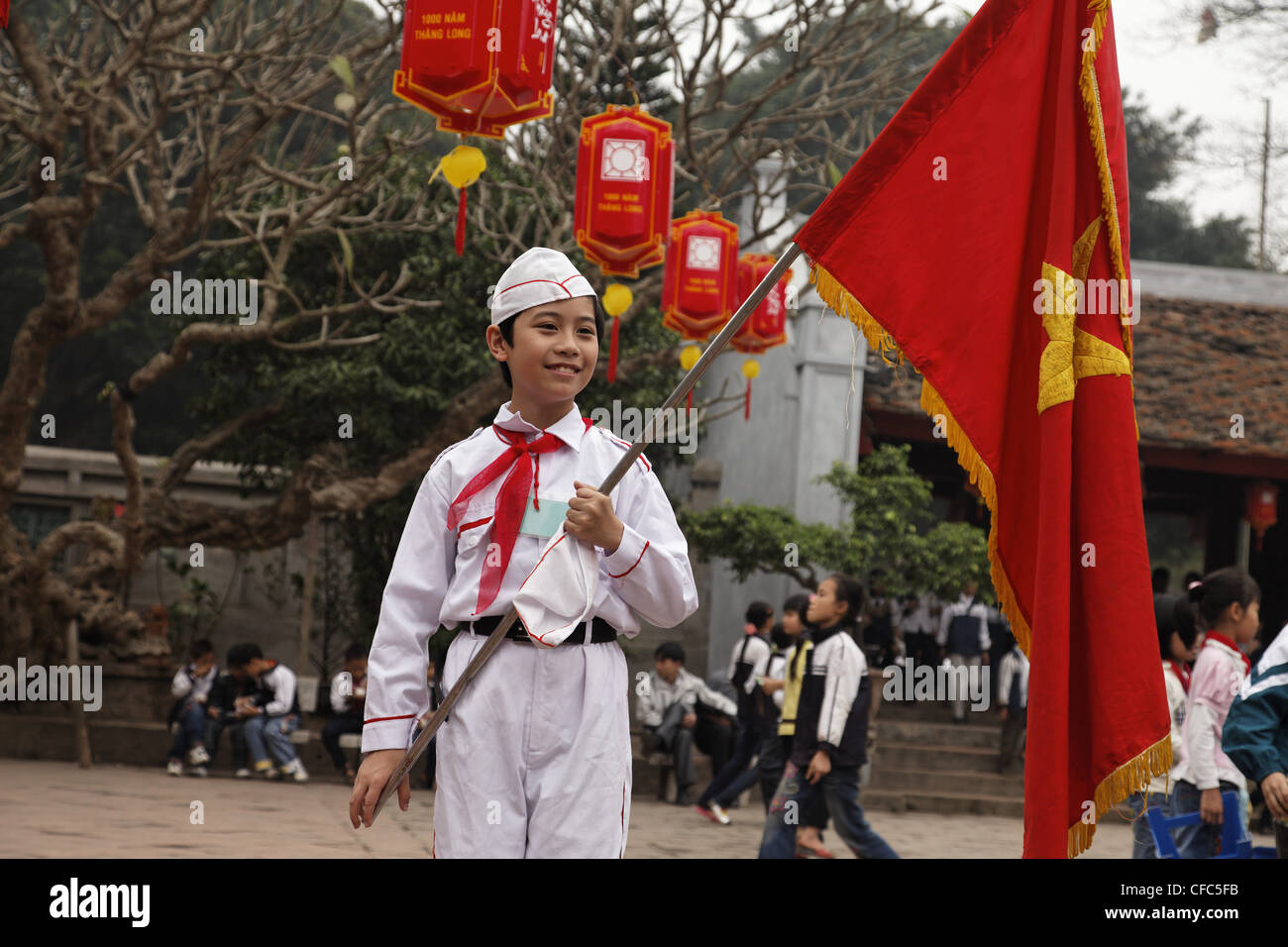 Pupil holding a flag, Temple of Literature (Van Mieu), Hanoi, Bac Bo, Vietnam Stock Photo