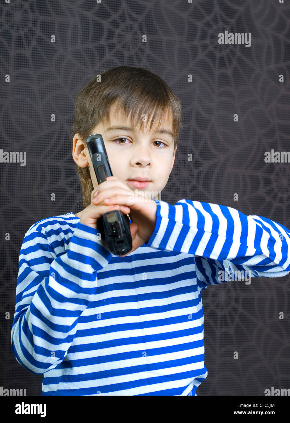 Young boy with a gun Stock Photo Alamy