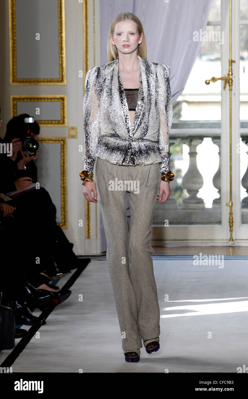 Balenciaga Paris Ready to Wear Autumn Winter Grey patterned blouse long  sleeves over black lace bra top, brown straight legged Stock Photo - Alamy