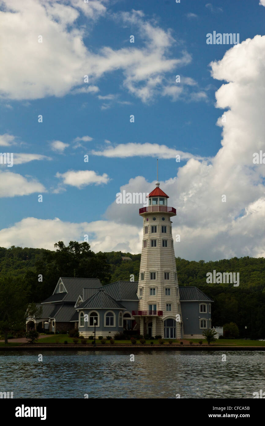 A home with a light house sitting on the coast of Lake Gunterville in