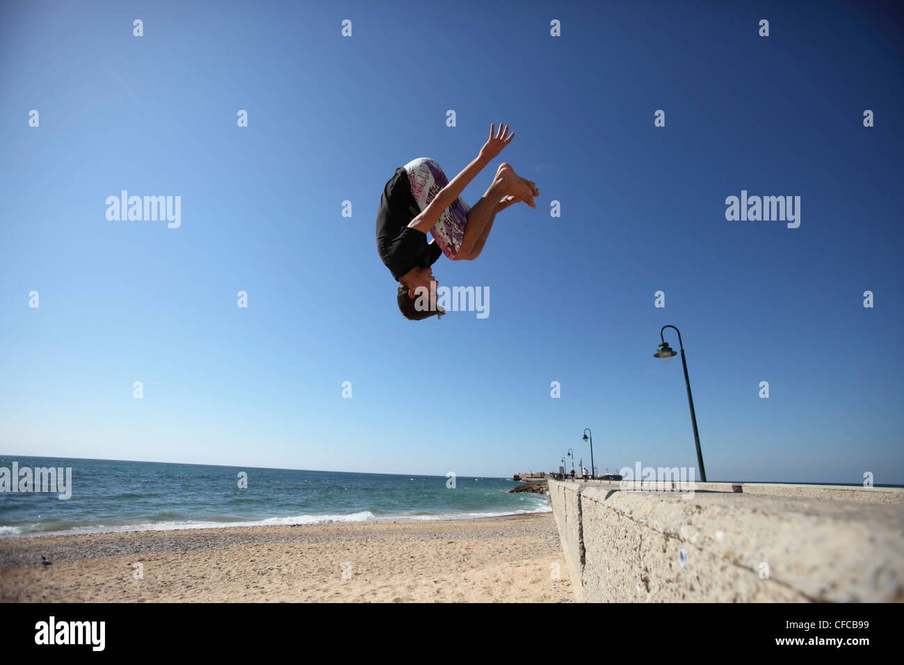 Boy jumping off pier hires stock photography and images Alamy