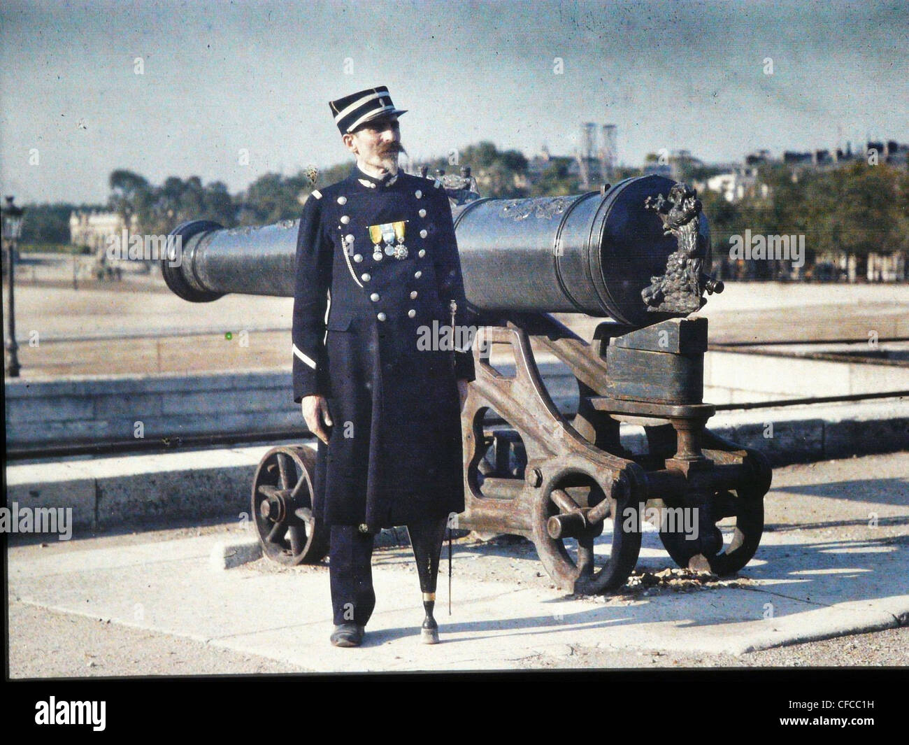 soldier, army, military, uniform, three, medals, standing, cannon, Paris, leg, replaced, artificial limb, World War I, War, Worl Stock Photo